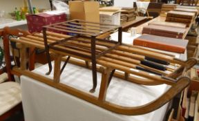 A vintage wooden sledge and a metal footman