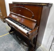 An Amyl upright overstrung piano