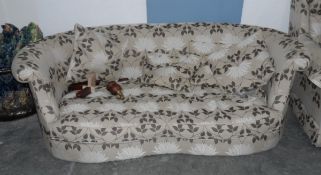A curved back wrap-round three seat settee upholstered in a floral fabric together with four loose