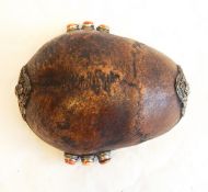 A white metal and coral mounted part skull bowl with skull and scroll decoration PLEASE NOTE
