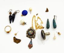 A millefiori pendant, the central circular boss decorated with flowers, with pendant drop beneath,