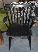 Three ebonised stickback open armchairs