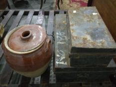 A large black metal trunk and a smaller black trunk (2)