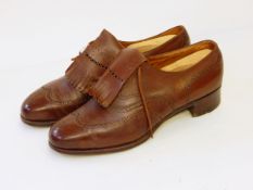 A pair of brown leather gentleman's shoes marked on inner leather sole 