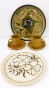 Percy Braseby stoneware plate and two Percy Braseby mugs (all PB impressed) and an unmarked plate