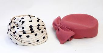 A black and white spotted 1950's hat from Harrods labelled 