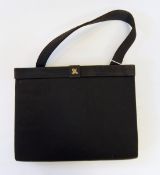 A satin evening bag with gilt fittings, bearing label inside 