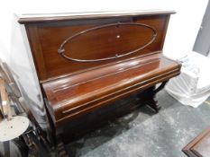 An Amyl upright overstrung piano