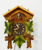 A Garrard mantel clock in oak case, a cuckoo wall clock,