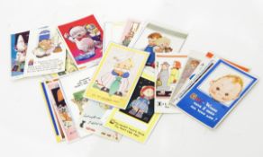 A large quantity of Mabel Lucie Attwell postcards, cigarette card album of wild flowers, calendars,