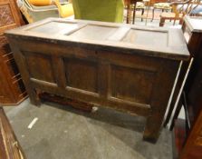 Eighteenth century oak coffer, with three panel top, and matching front, on stile supports,