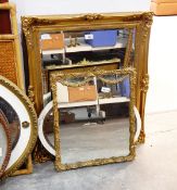 A rectangular gilt framed wall mirror and three others