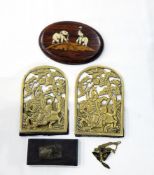 A miniature silver-coloured elephant on stand,