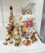 A Goebel table lamp modelled as a young girl perched on a tree branch with dog below,