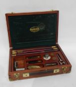 A Parker-Hale 12 gun cleaning kit with rods, brushes, snap caps,
