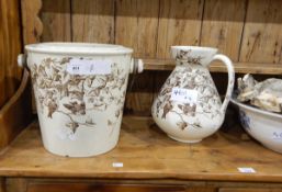 A ewer and wash bowl with drainer, cream ground,