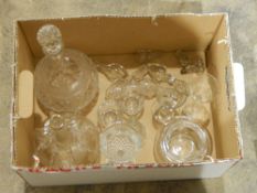 A cut glass decanter, various cut glass stoppers, another decanter, glass bell, etc.