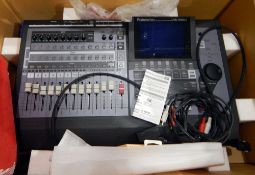 A Roland 24 bit digital studio workstation VS-1880 in its original box, a Stealth plug,