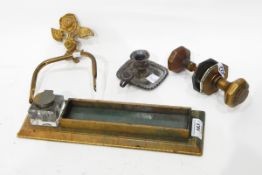 A pair of brass door handles, a chamberstick,