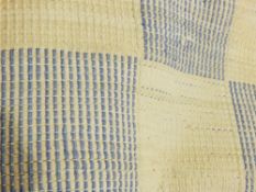 A large blue and white check rug