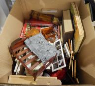 A quantity of doll's house furnishings including fireplaces, doors, furniture, etc.