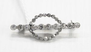 Early 20th century diamond bar brooch set with 10 Swiss cut diamonds to centre bar and surrounded