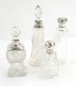 Three cut glass dressing table bottles with silver mounts and one other