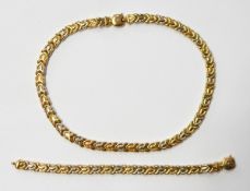 18ct yellow and white gold arrowhead design necklace and matching bracelet, 65g approx.