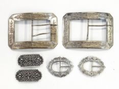 Pair of Victorian silver buckles of oval form with pierced engraved decoration,