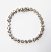 Platinum and diamond tennis bracelet set 29 round brilliant cut collet-set diamonds, the diamonds 9.