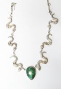 Silver necklace by Fiona Greenwood with central green hardstone pendant flanked by three serpents