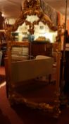 An antique style giltwood wall mirror,