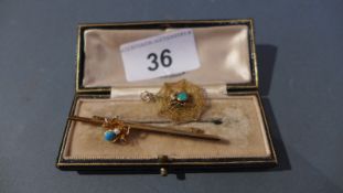 A 15ct gold spider form stick brooch with inset turquoise and seed pearl together with the matching