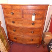 A Victorian mahogany bowfront chest fitted two short and three long drawers raised on turned feet.