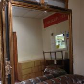 An Empire style wall mirror of large proportions,