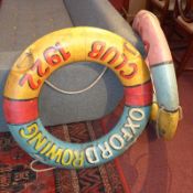 A pair of painted model lido life rings.