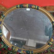 A 19th century wall mirror, the oval plate within painted moulded frame.