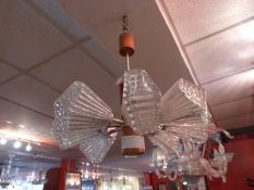 A Temde Leuchten pendent light with eight reeded glass shades.
