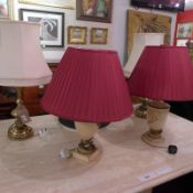 A pair of brass table lamps, a pair of painted urn form table lamps and a standard lamp,