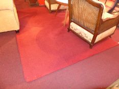 A contemporary rug in thick rouge wool pile.