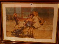 An original Pears lithograph by Fred Morgan depicting children on a beach.