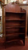 A mahogany music cabinet with gallery back and four shelves.