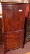 A Georgian style mahogany serpentine fronted side cabinet fitted pair of panel doors above brushing