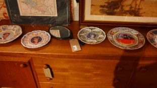 A 1920's ebony dressing table mirror with oval bevelled plate together with five porcelain