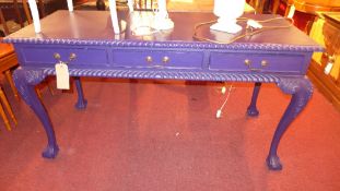 A French design blue painted writing table fitted three drawers and raised on cabriole supports.