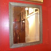 A 19th century wall mirror, the rectangular bevelled plate within painted distressed finish frame.