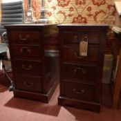 A pair of Victorian mahogany pedestal chests fitted four drawers with brass handles on plinth bases.