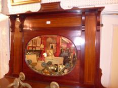 An Edwardian inlaid mahogany overmantel mirror with oval bevelled plate.