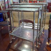 A 20th century faux bamboo brass nest of three tables with glass tops together with a 19th century
