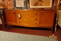 A retro mid 20th century oak sideboard fitted three central drawers flanked by panel doors.